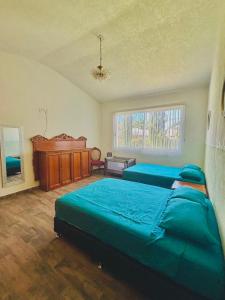 Postel nebo postele na pokoji v ubytování Casa Coco