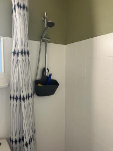 a shower in a bathroom with a shower at Døstrup Landevejskro & Motel in Skærbæk +77 photos
