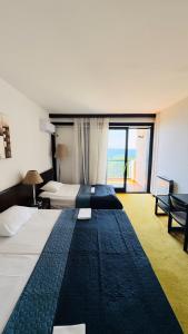 Postel nebo postele na pokoji v ubytování CORPUS A - Hotel Albatros