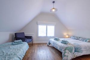 Ένα ή περισσότερα κρεβάτια σε δωμάτιο στο Chez mamie gigi