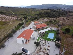 an aerial view of a house in a vineyard at Quinta de Gandarem in Torre de Moncorvo
