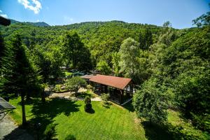 an aerial view of a house in the middle of a forest at Complex Magiyata na Rila in Rilski Manastir