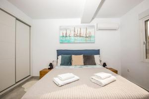 Postel nebo postele na pokoji v ubytování Mimosa Calpe Apartament + 9 fotografií
