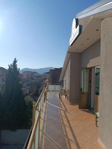a balcony of a building with a view of the city at Blessed guest house in Shkodër