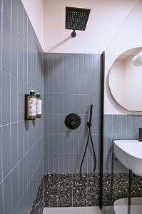 a bathroom with a shower and a sink at Montebello Living in Ancona