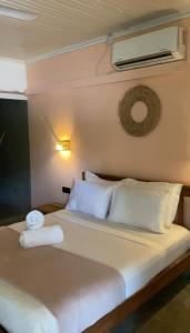 a bedroom with a bed with two towels on it at Sky Breeze in Unawatuna