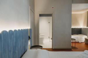 Katil atau katil-katil dalam bilik di Deb&spa