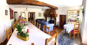 a living room with a couch and a table at Chez Providence Chambres et Table d'Hôtes in Cuxac-Cabardès