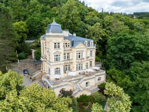 an aerial view of a mansion in the trees at Villa Julius a Emma - Luxury Boutique Retreat in Karlovy Vary