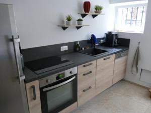 Køkken eller tekøkken på Appartement avec piscine privée