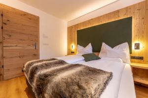 Ένα ή περισσότερα κρεβάτια σε δωμάτιο στο Maginta Appartements Lercher