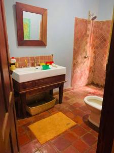 a bathroom with a sink and a toilet at Maya safari village in Arusha