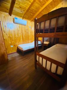 a bedroom with two bunk beds in a cabin at Portal del sol in Puerto Iguazú +75 photos