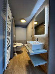 a bathroom with a white sink and a toilet at 1Dest - Arco Climbing in Arco +59 photos