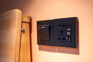 a electrical outlet on the wall of a room at Carnarvon 73 in George Town
