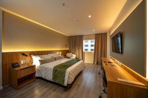 Ένα ή περισσότερα κρεβάτια σε δωμάτιο στο Rio Hotel By Bourbon Luque Asuncion