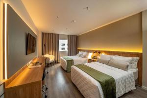 Ένα ή περισσότερα κρεβάτια σε δωμάτιο στο Rio Hotel By Bourbon Luque Asuncion +35 φωτογραφίες
