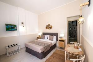 Ένα ή περισσότερα κρεβάτια σε δωμάτιο στο A Casa Di... Aurora 2