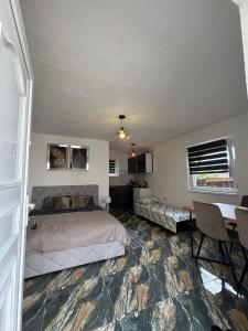 a bedroom with a bed and a table in it at Old Town Maglaj in Maglaj