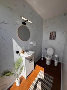 a bathroom with a white sink and a toilet at New Generation Camp in Siedliska +74 photos