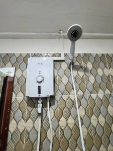 a hair dryer on the wall of a room at Nice Beach Bungalow in Koh Rong Island +82 photos