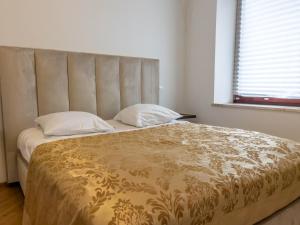 Кровать или кровати в номере By the river Ljubljana apartment