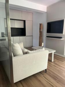 a living room with a white couch and a table at Marbella-abc-aparts in Marbella
