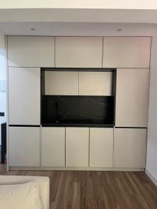 a living room with a large white entertainment center at Marbella-abc-aparts in Marbella