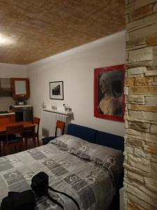 a bedroom with a bed and a table in a room at Le Cupe in Corciano