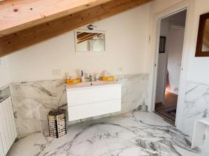 a bathroom with a sink and a marble floor at Rebecca House, Sestri Levante in San Bernardo +26 photos