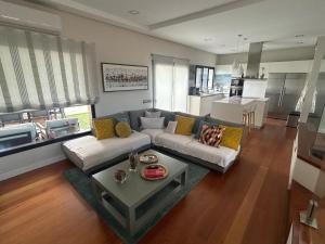a living room with a couch and a table at Villa Hoyeta in Ingenio +14 photos