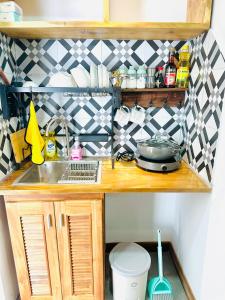 a small kitchen with a sink and a counter at 308MSNK Maison Luxe Studio l Balcony & Kitchen in Can Tho