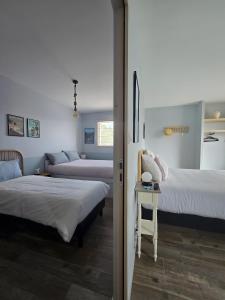 En eller flere senge i et værelse på Chambres D'hôtes Authentique Pornic