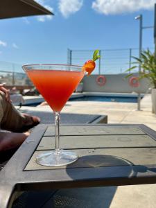 a drink in a glass sitting on a table at Silken Ramblas in Barcelona +58 photos