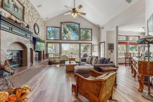 a living room with a couch and a fireplace at Summit Sanctuary in Lake Arrowhead