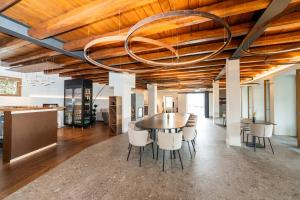 a dining room with a table and chairs at Borgo Capietaglio Wine Resort in Gromlongo