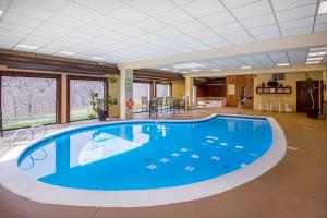 a large swimming pool in a large room with a large ceiling at 5B Mountain Village- Unit B in Dover