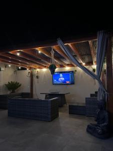 Et tv og/eller underholdning på Maison proche de la plage