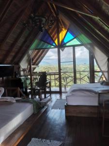 Ένα ή περισσότερα κρεβάτια σε δωμάτιο στο Cabañas la Miranda +124 φωτογραφίες