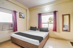 Ένα ή περισσότερα κρεβάτια σε δωμάτιο στο Hotel O Radhe Radhe Near Jaipur International Airport Jaipur International Airport +21 φωτογραφίες