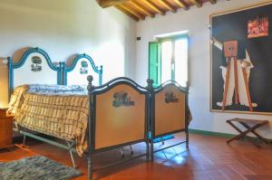 a bedroom with a bed in a room at Casa Alta in Pistoia