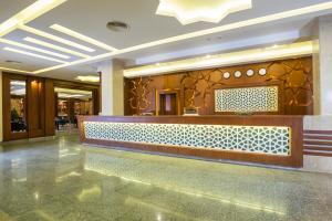 a lobby with a reception desk in a building at Pickalbatros Aqua Park Resort - Hurghada in Hurghada