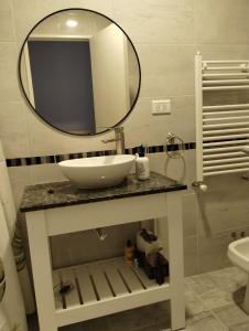 a bathroom with a sink and a mirror at Descanso en el Sur in Playa Unión +14 photos