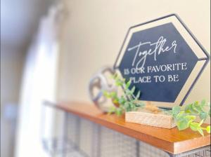 a shelf with a sign on top of it at Private Getaway with Balcony in Columbus