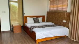 Postel nebo postele na pokoji v ubytování Villa 107 Thang Mây Villa Resort, Ba Vì + 15 fotografií