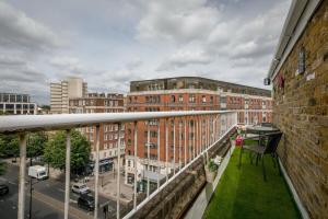 a balcony with a view of a city with buildings at Lovely & Cosy 2BR 2Bath 'Penthouse' Steps to Hyde P in London