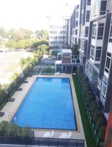 an overhead view of a swimming pool in a building at My hip Condominium 2 Bedrooms 2 baths comfy room for family in Chiang Mai