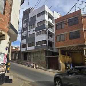 a building under construction on a city street at Quirpinchaca Premier in Sucre