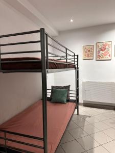 a couple of bunk beds in a room at Gołębia Group Room in Poznań