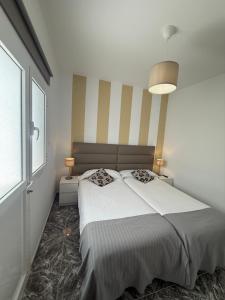 Postel nebo postele na pokoji v ubytování Apartamentos La Aldea Suites
